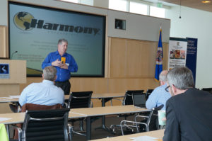 Mikel of Harmony Enterprises, Inc. speaking at Enterprise MN event. Minnesota Manufacturing