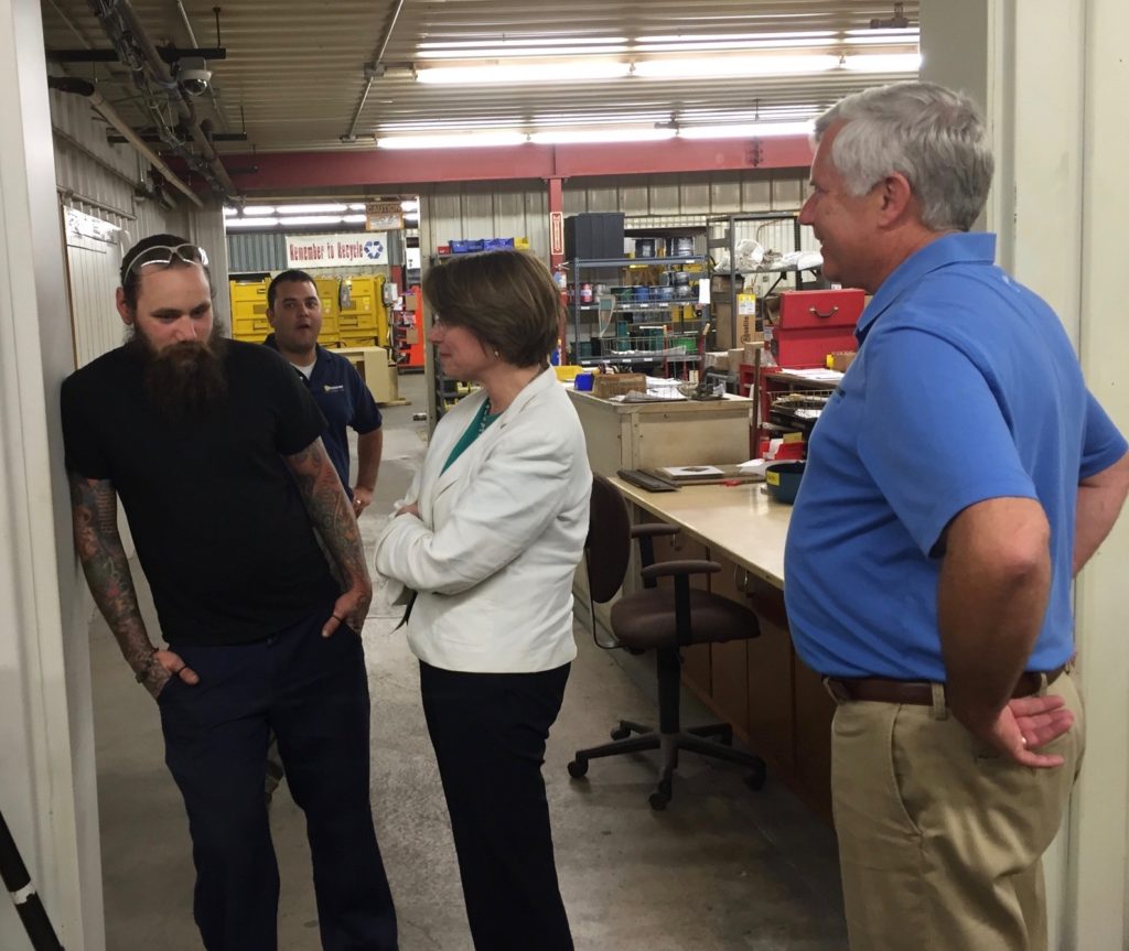 Senator Amy Klobuchar visited Harmony Enterprises. Here she is catching up with her nephew, Josh Bessler, who worked at Harmony Enterprises as a welder.