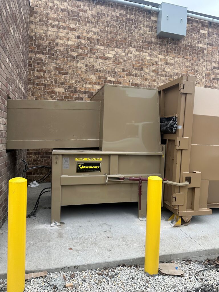 2 yard short back stationary compactor - earth day 2026