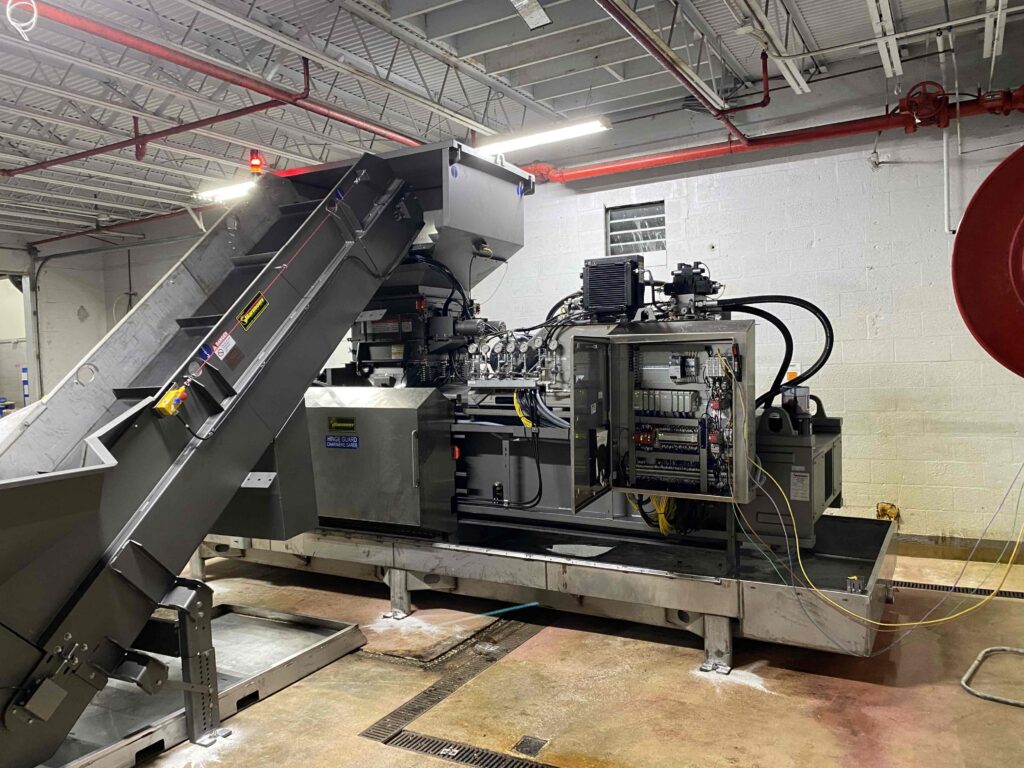 conveyors and tippers help with liquid extraction baler automation